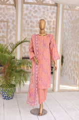 Mannequin wearing a pink traditional outfit with floral patterns in a decorative setting.
