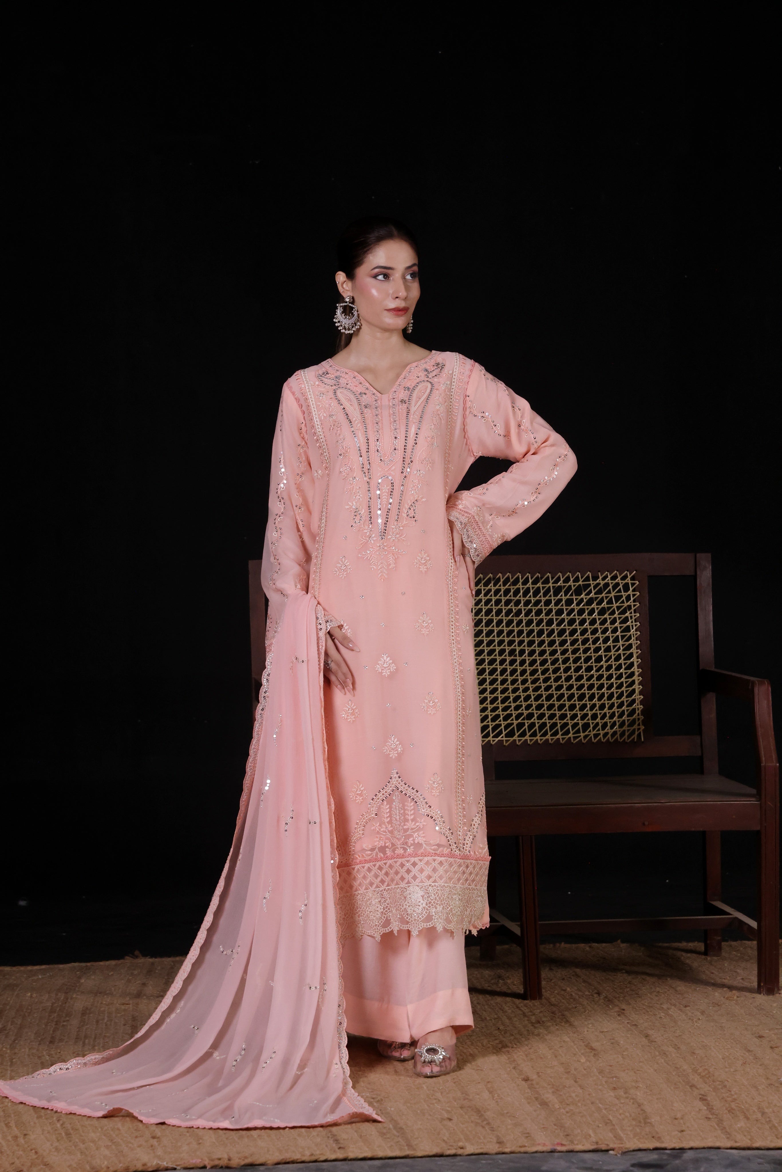 Woman in pink embroidered traditional outfit,  SAFFRON,  a stunning blend of luxury and sophistication. Crafted from premium chiffon fabric