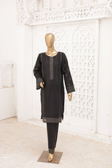 Black traditional outfit on a mannequin against a white decorative wall.