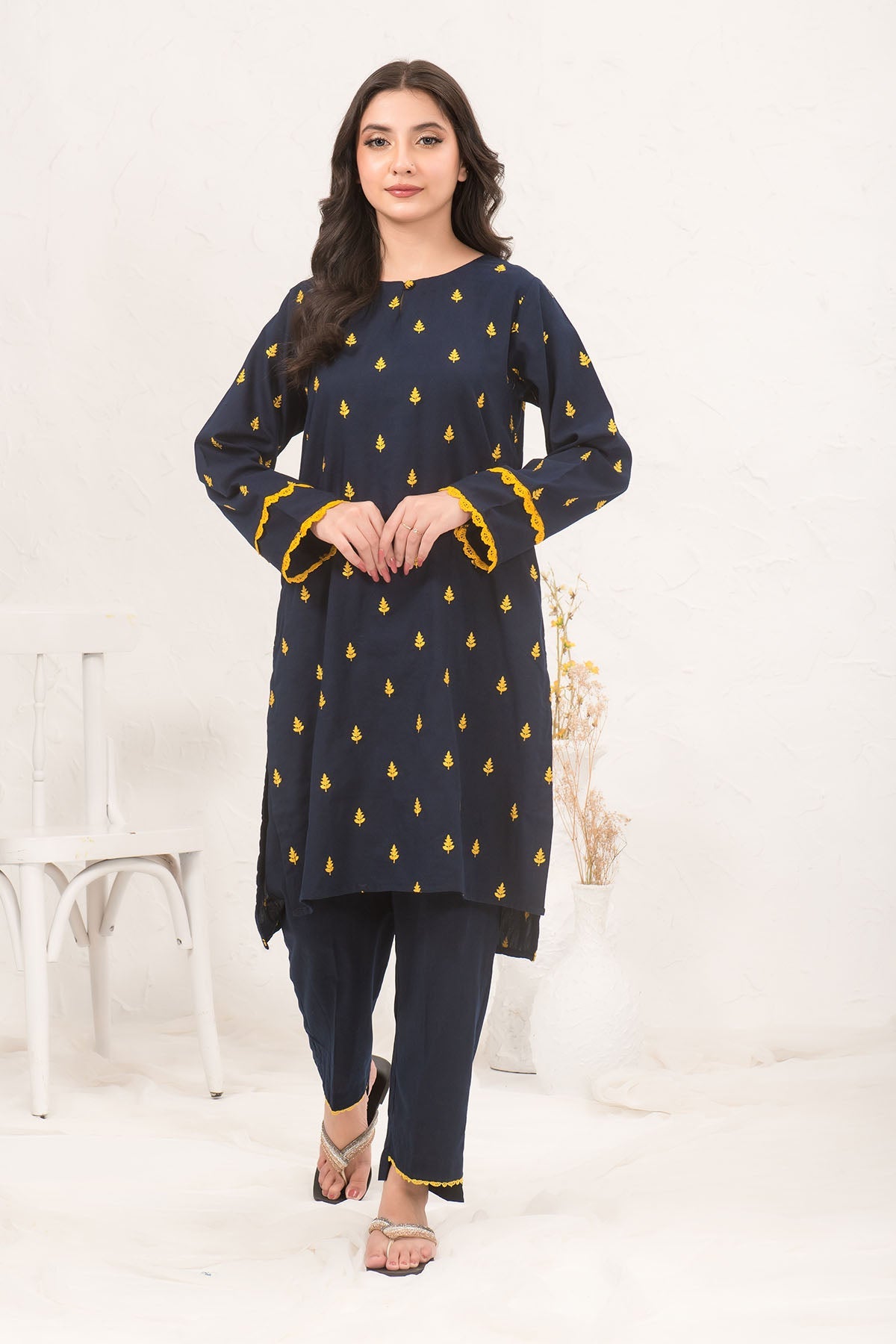 Charming Cotton Embroidered 2-piece suit featuring detailed embroidery designs, offering a blend of traditional elegance and modern style for a graceful look.