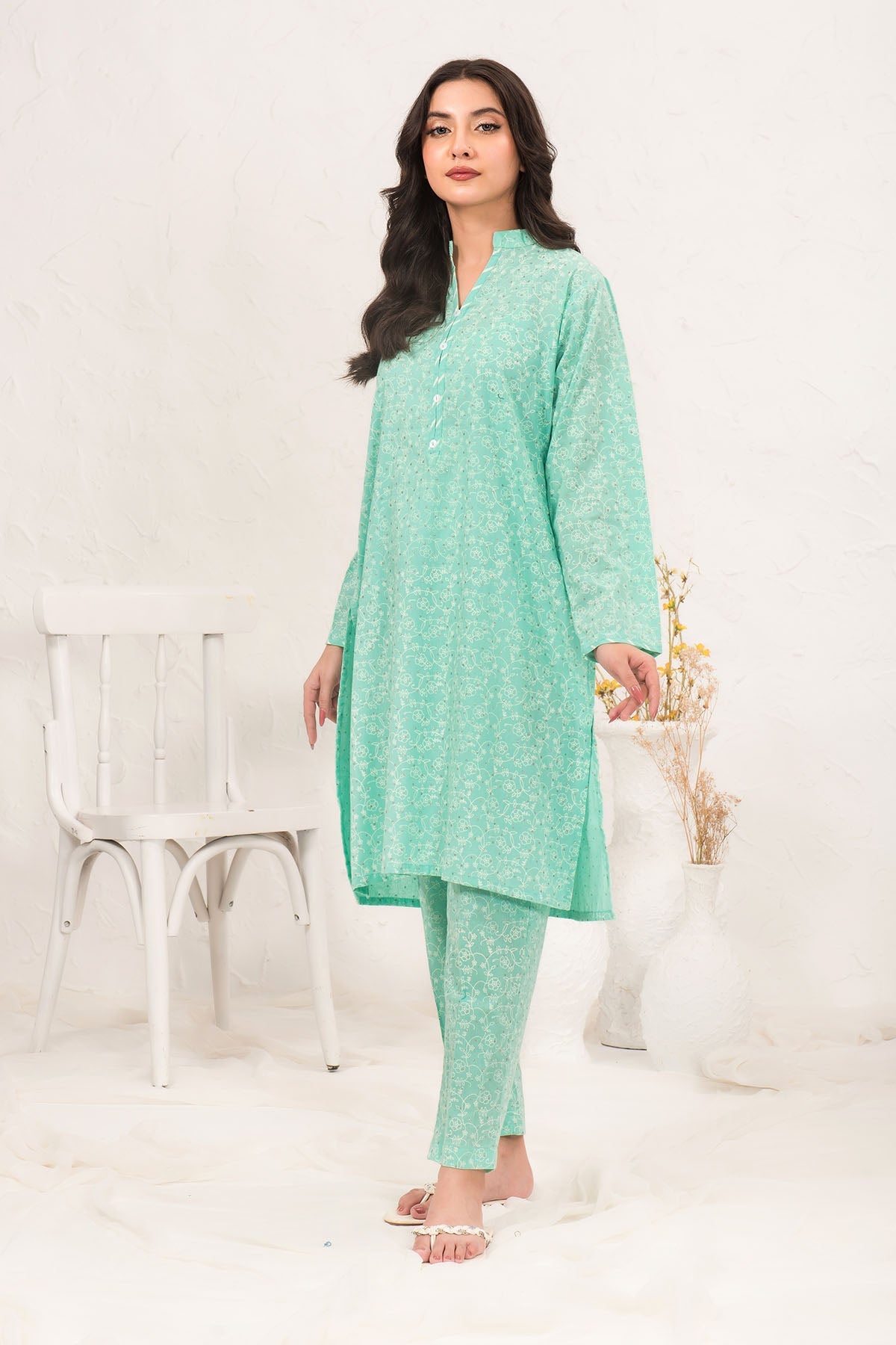 Elegant Cotton Printed 2-piece suit designed for Pakistani women, featuring intricate patterns and breathable fabric for a stylish and comfortable look.