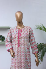 Mannequin wearing a floral dress with pink accents on a white background
