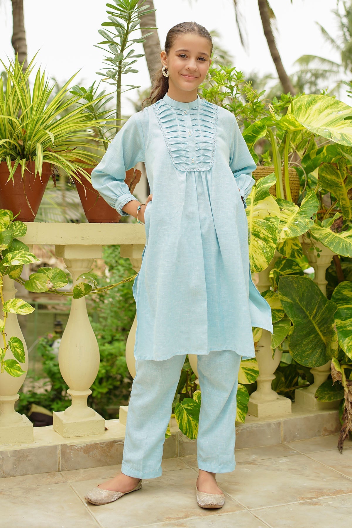 The Khaddar Embellished 2-Pc Suit features chic detailing for a stylish look. Perfect for any occasion, it blends comfort with elegance effortlessly!
