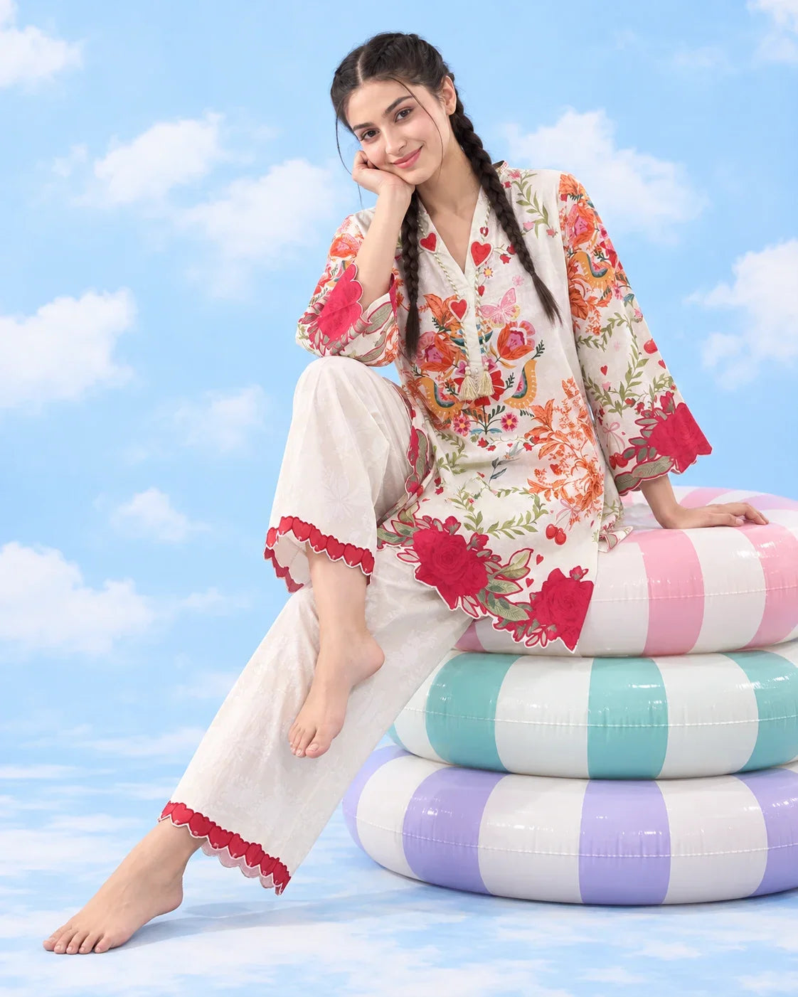 Cupid ivory floral lawn co-ord seated on pastel pool rings