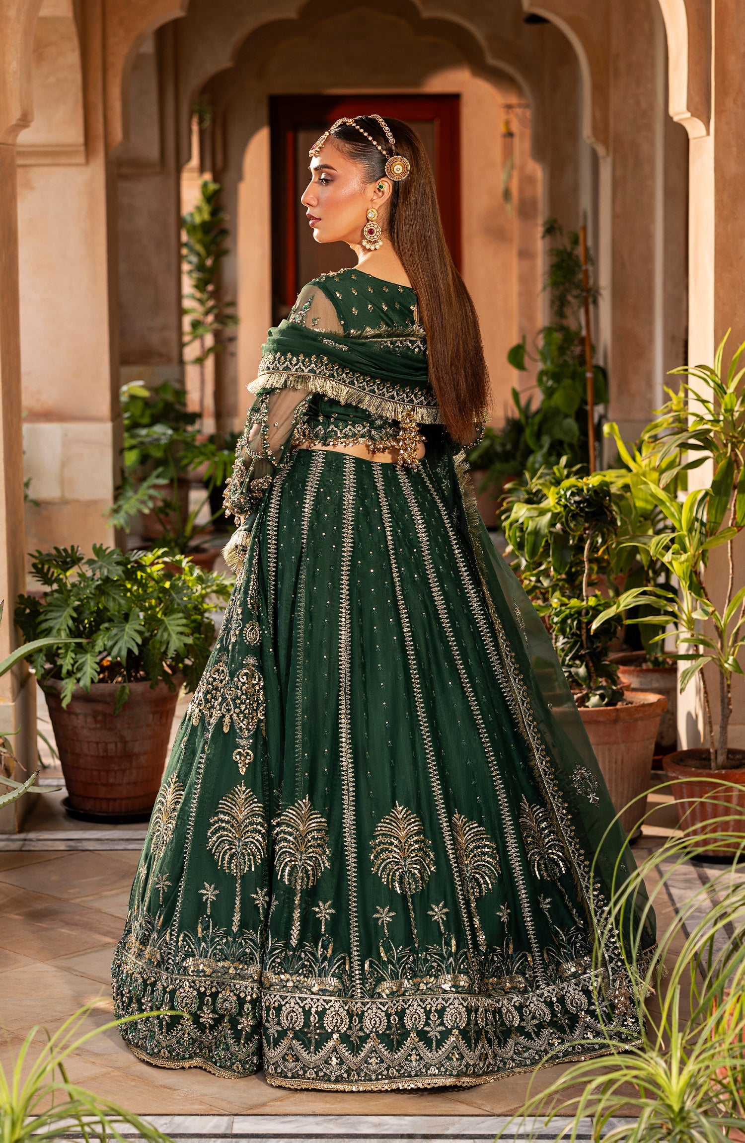 Back view of Aylin emerald maxi dress with graceful fall